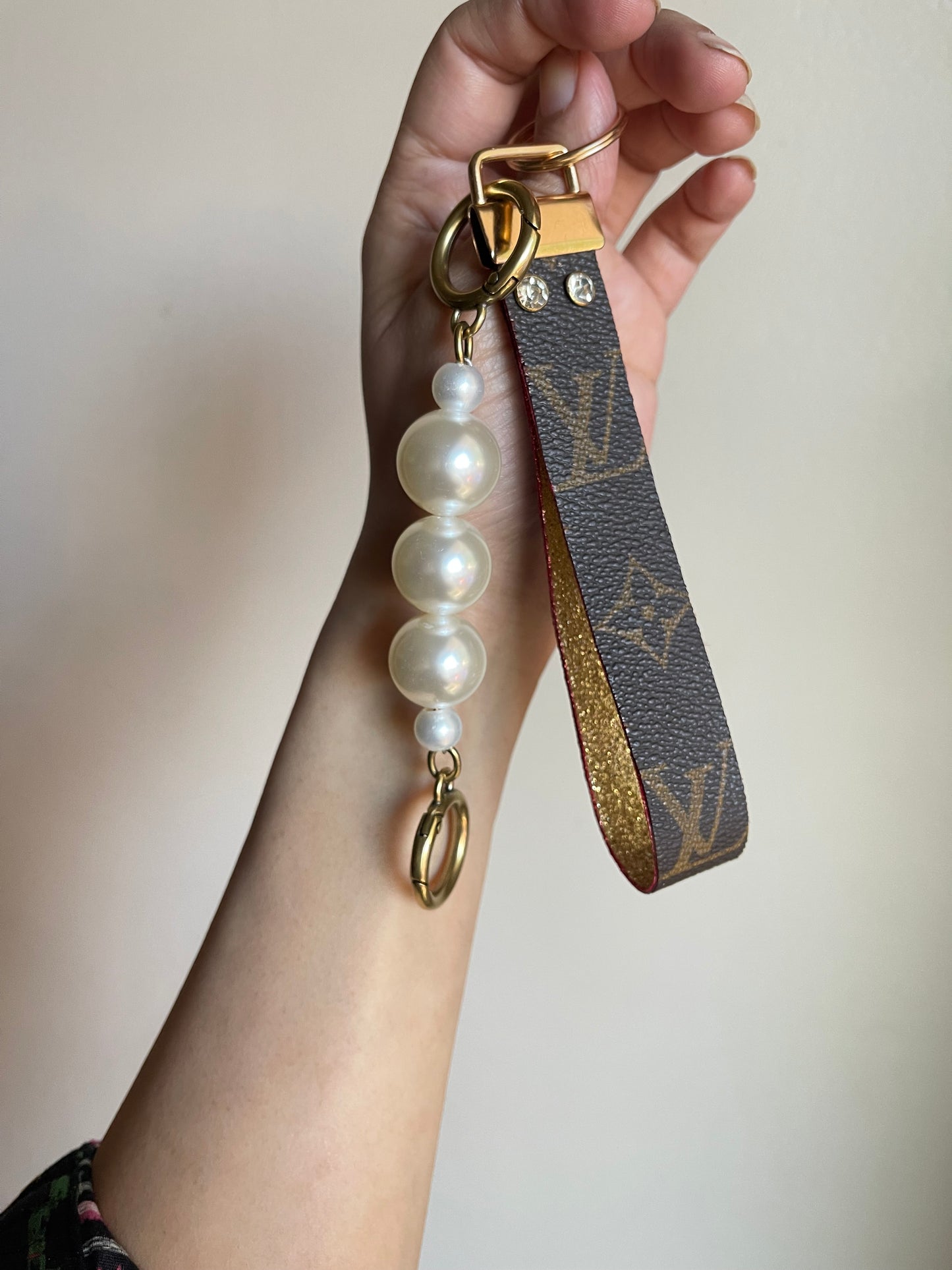 Upcycled monogram wristlet