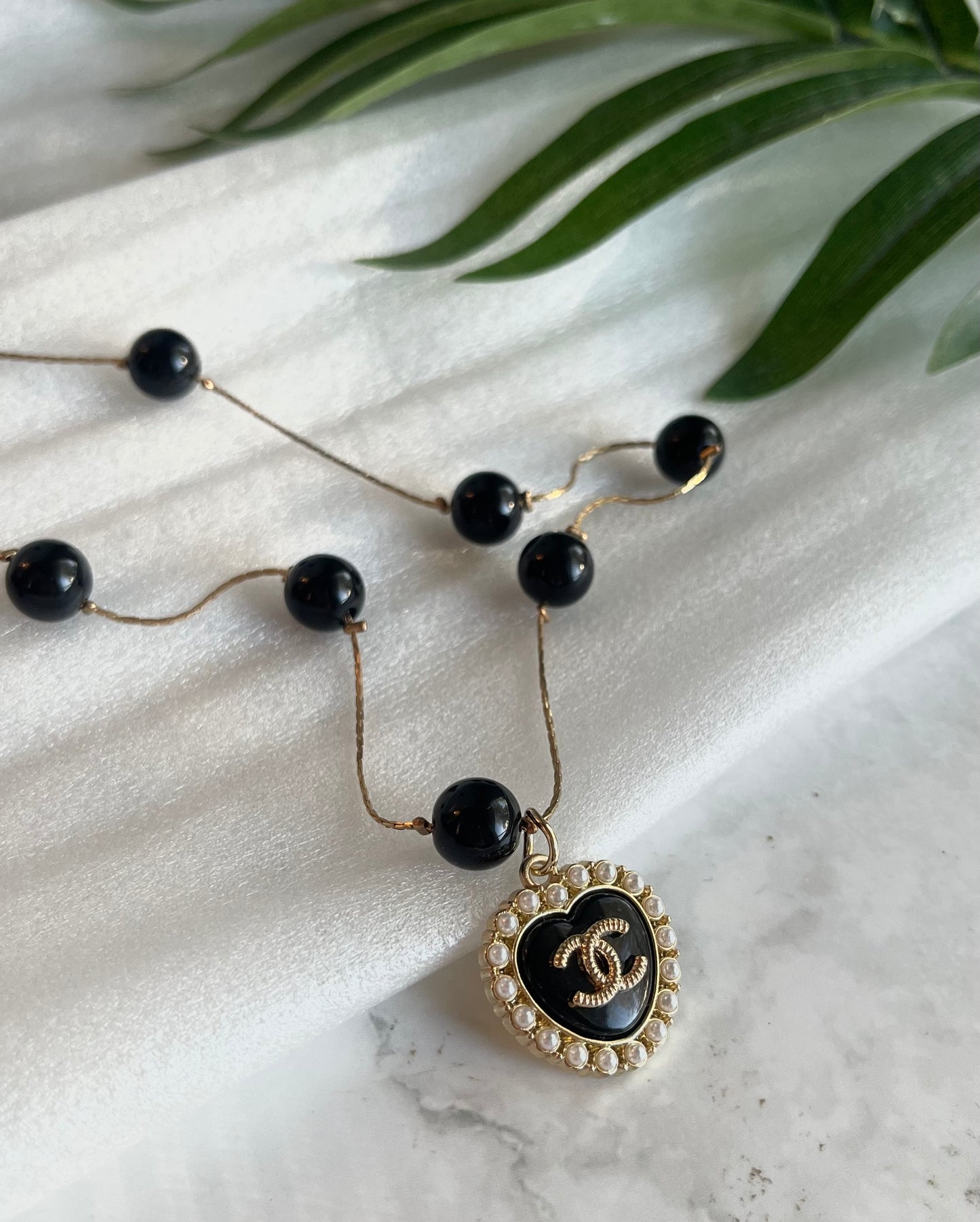 Upcycled Chanel charm necklace