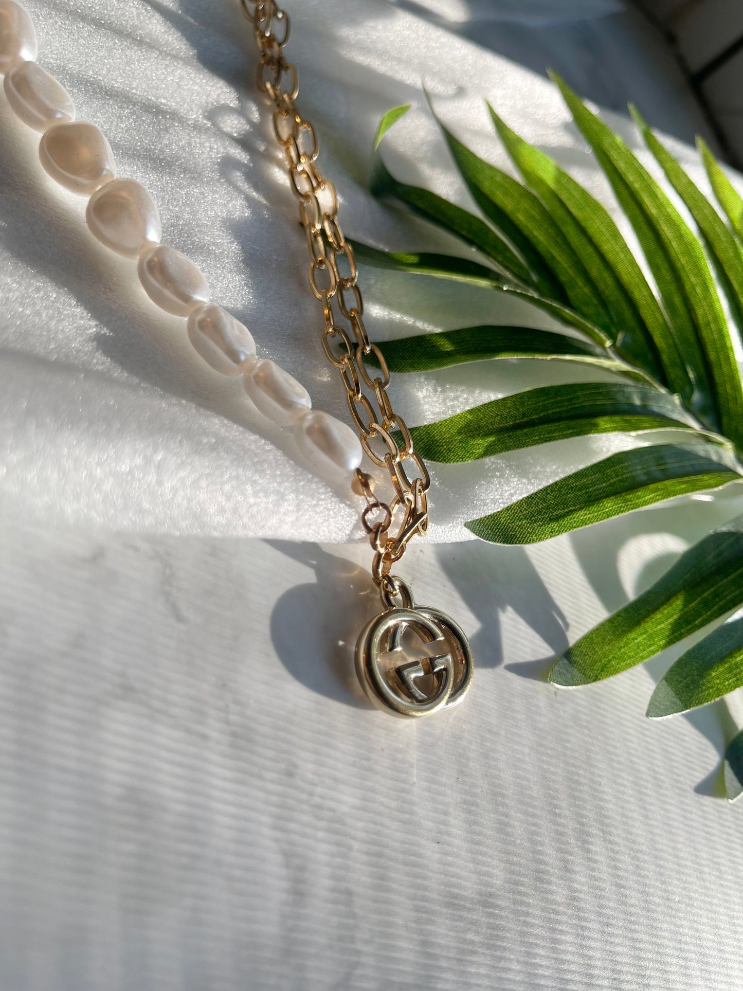 Upcycled charm necklace in gold and white