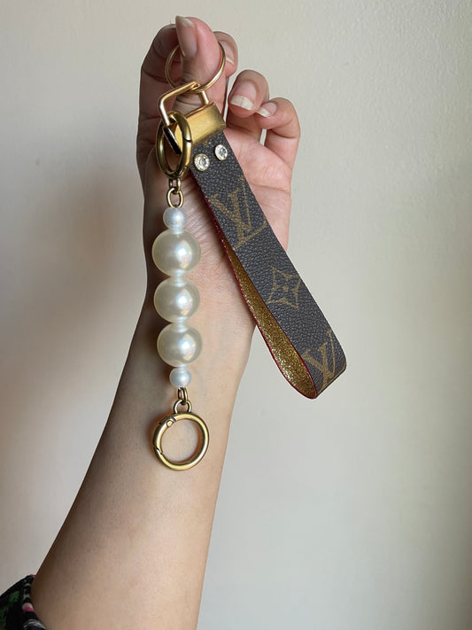 Upcycled monogram wristlet